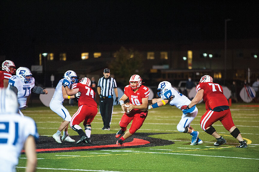 10-8 perry Chanse McKenzie steps up in the pocket looking to tuck and run.jpg